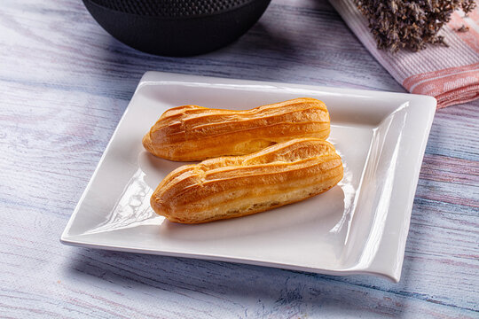 Sweet baked eclair dessert with cream