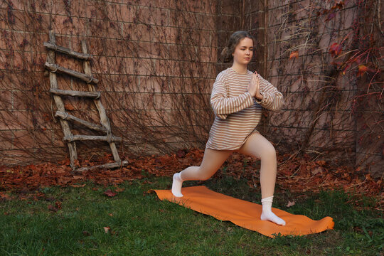 A beautiful young girl is doing sports 