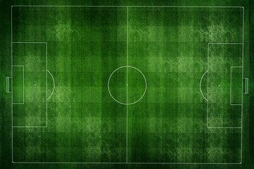 Fototapeta premium Aerial view of a textured green soccer field with clear white line markings and a worn, realistic grass surface. An empty professional football pitch from above, ready for competition or training.