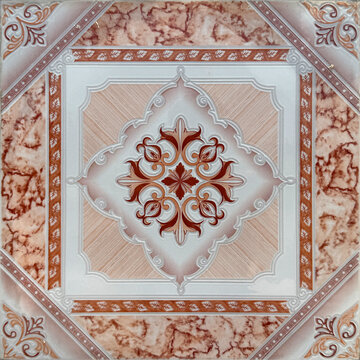 Colonial heritage tiles in random ornate classic swirls and floral diamond medallion in the middle. In red, pink, and peach color. Antique classic and royal tiles. Seamless background texture.