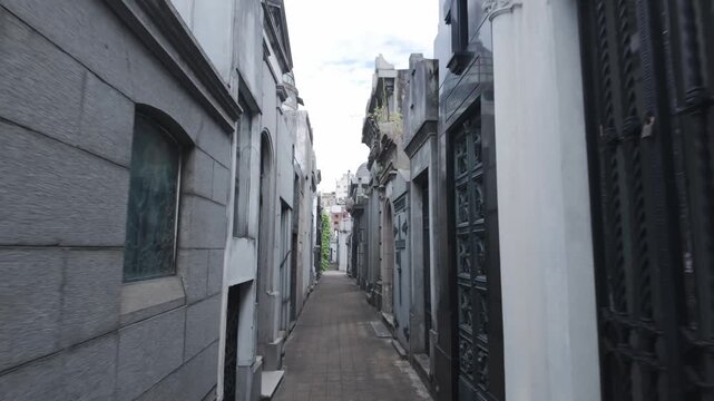 Buenos Aires , Argentina. 15.01.2026 : Narrow hallways of La Recoleta cemetery old stone gravestone buildings 