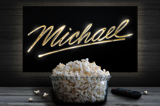 Cali, Colombia - May 4 2026: Popcorn bowl and TV displaying Michael glowing signature