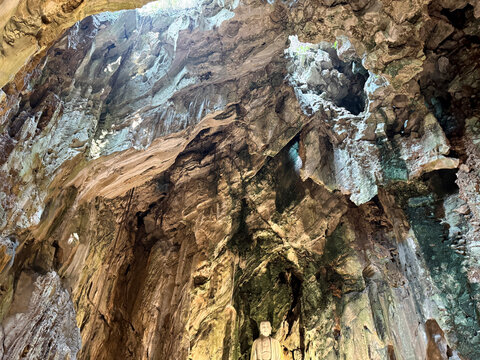 Texture of a rough stone inside a rocky cave carved by nature with a detailed rock formations. Nature and background texture