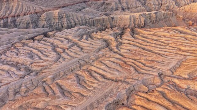 Vivid colorful layered sedimentary mountain with striped geological pattern in Altyn Emel, Kazakhstan