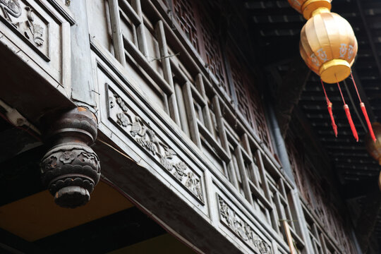 Ancient Chinese architecture wooden carving on exterior building and Chuihua column (hanging flower column) at Jinli Ancient Street, Chengdu, Sichuan Province of China