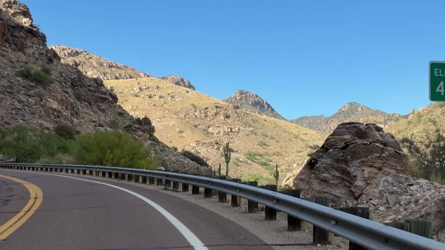 Driving in Arizona desert near Tucson with view of Mount  Lemmon, city dashcam, scenery of the american west	