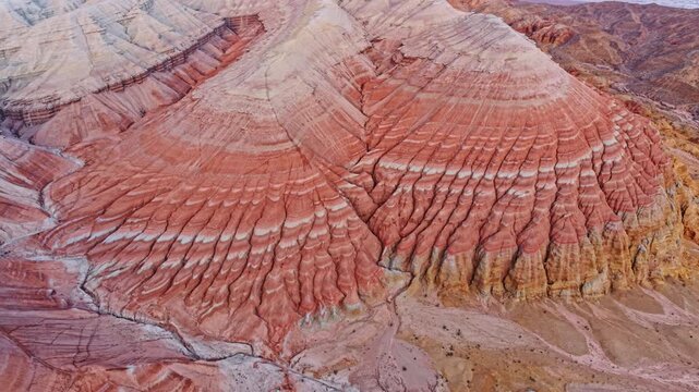 Vivid colorful layered sedimentary mountain with striped geological pattern in Altyn Emel, Kazakhstan