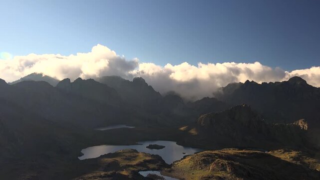 Timelapse of mountain lakes and fast clouds over treeless high altitude Anatolia terrain. Scenic alpine pools beneath drifting sky across rugged Turkish plateau and remote uplands.