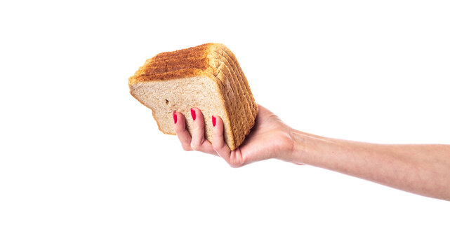Hand with square slices of whole wheat bread, healthy food. Isolated on white background.