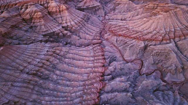 Vivid colorful layered sedimentary mountain with striped geological pattern in Altyn Emel, Kazakhstan