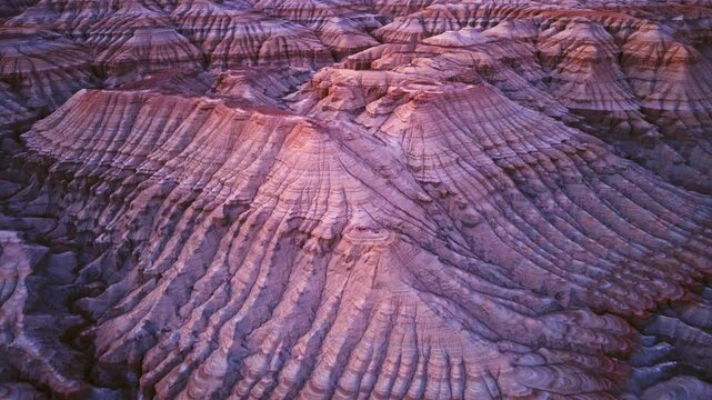 Vivid colorful layered sedimentary mountain with striped geological pattern in Altyn Emel, Kazakhstan
