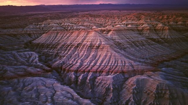 Vivid colorful layered sedimentary mountain with striped geological pattern in Altyn Emel, Kazakhstan