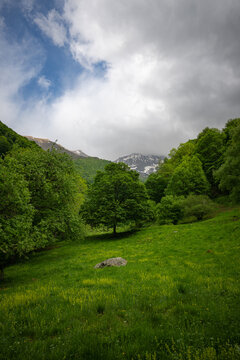 Green mountain landscape with clouds. Ariege Pyrenees France
