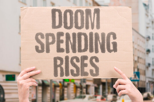"Doom Spending Rises" Perceptions of systemic global instability drive measurable increases in impulsive consumer expenditure. DOOM. SPEND. CONSUMER. INSTAB. IMPULSIVE.