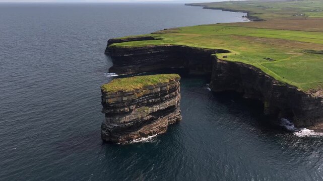 Downpatrick Head in Ireland at Sunny Day, Aerial Drone Shot. Stunning High Cliffs, Dun Briste Irish Coastal Landmark.