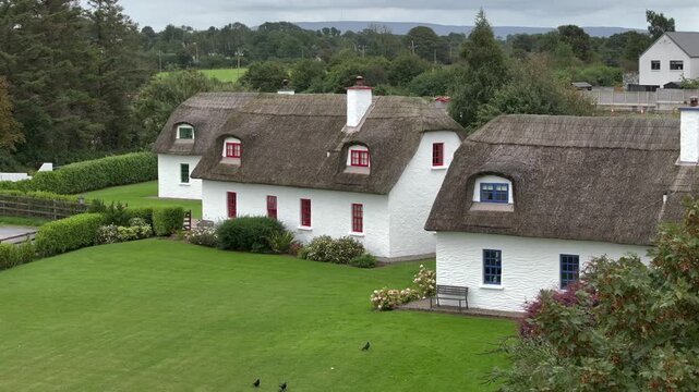 Typical Irish White Washed Houses with Thatched Roof. Authentic and Historical Cozy Cottage in Ireland, Aerial View