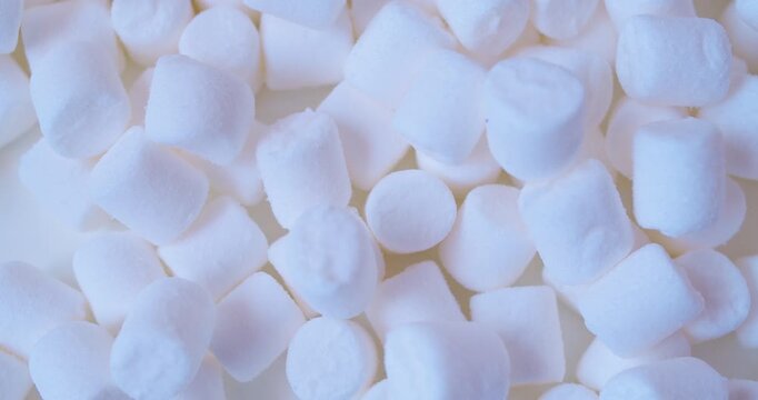 A close-up of  marshmallow pieces.Sweet food. Background