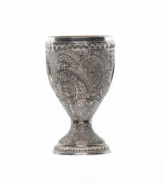Ancient silver wine goblet isolated on white background