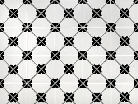 Pattern colonial heritage tiles in random diamond and floral pattern. In black and white color. Monochrome fancy tiles. Suitable for flooring. Bathroom and kitchen. Seamless background texture.
