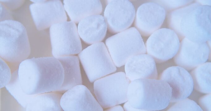Sweet food background.Small marshmallows close up.