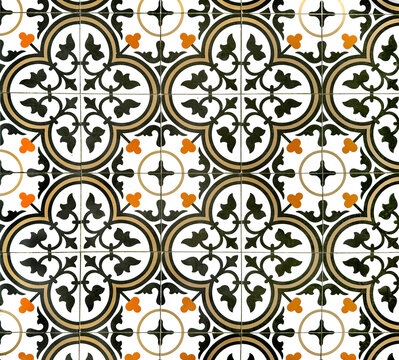 Colonial heritage tiles in random floral, star, ornamental, engraving patterns. Handmade colonial tiles, or old heritage tiles in black, brown, orange, and white color. Seamless texture.