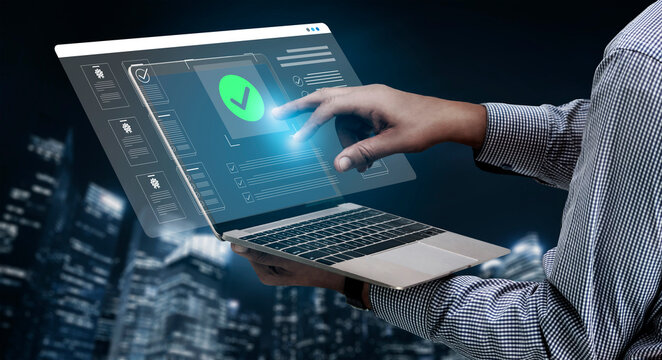A hand reaches out to interact with a futuristic laptop interface showing a digital check mark, symbolizing success and technology in an urban night setting. Cyphers