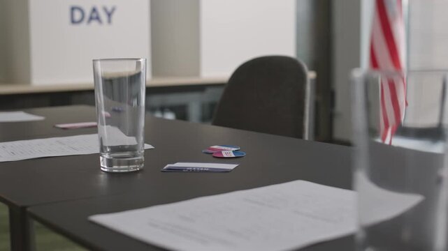 Meeting room setup with glasses of water and documents