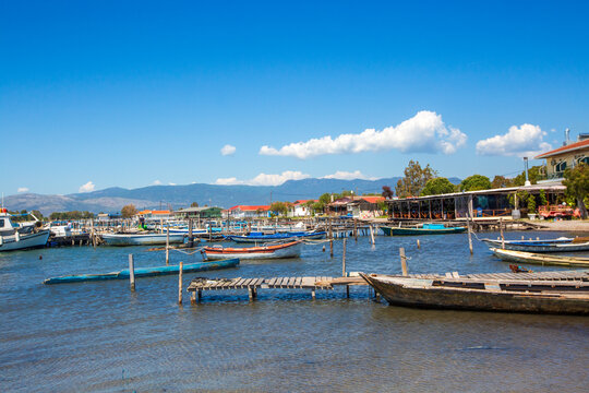Scenic view of traditional fishing boats and wooden piers in Tourlida village, Messolonghi lagoon, Greece