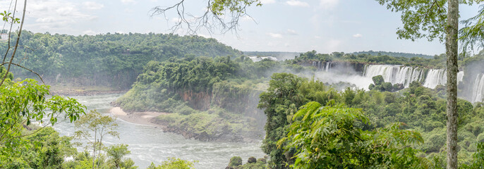 waterfall jumps in rain forest vegetation and Iguazu inferior river cove at nature park, Iguazu Waterfalls, Argentina © hal_pand_108