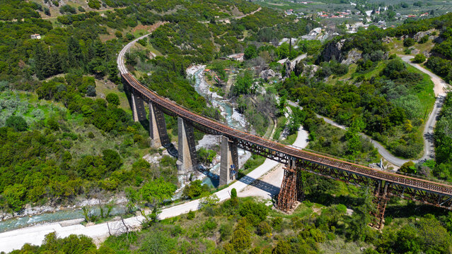 Aerial view of the historic Gorgopotamos railway viaduct over the river in central Greece