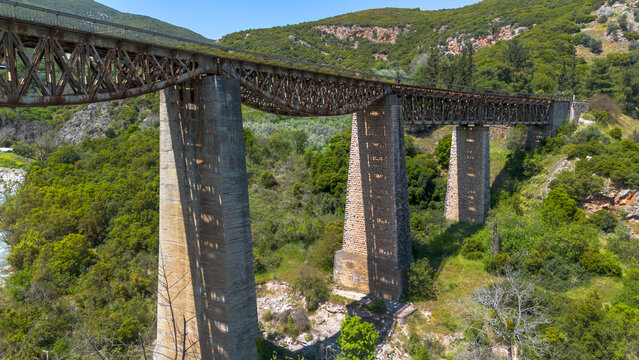Aerial view of the historic Gorgopotamos railway viaduct over the river in central Greece
