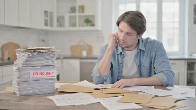 Delinquent person with many bills at home.