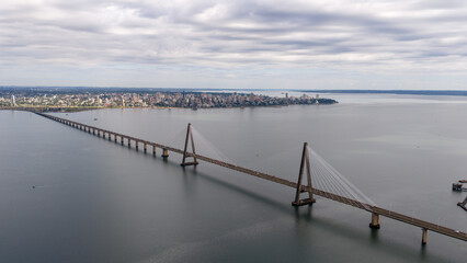 Fototapeta premium Side view of the Roque Gonzalez Bridge stretching across the Parana River on a cloudy day, Argentina and Paraguay.