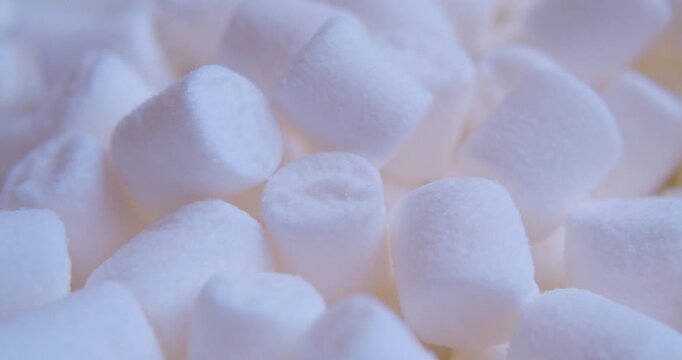 Sweet food background.Small marshmallows close up.