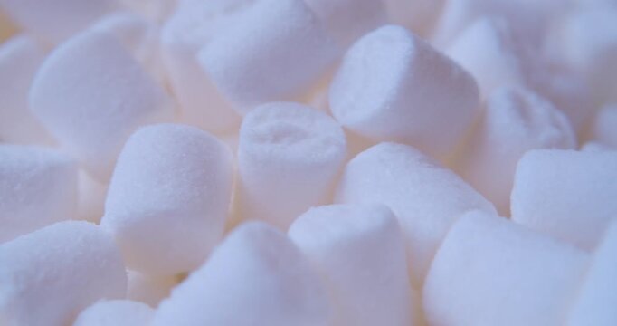 A close-up of  marshmallow pieces.Sweet food. Background