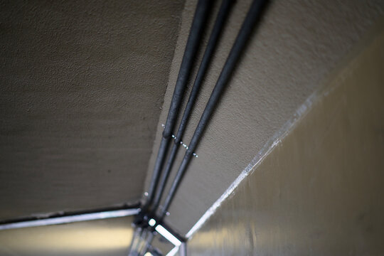 Parallel electrical conduits on ceiling