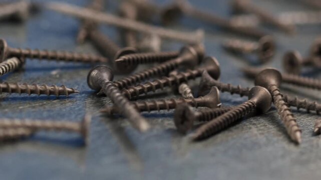 Metal screws for fastening equipment. Soft focus. Close-up. 