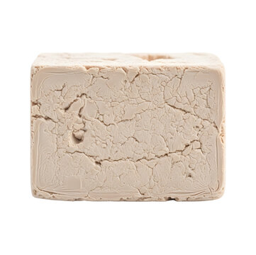 Block of beige modeling clay on transparent background
