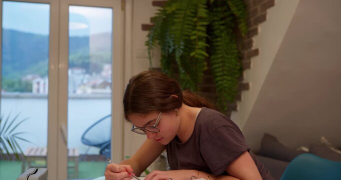 Young Woman Reading: A young woman intently reads, framed by a cozy interior, offering a serene atmosphere of learning and contemplation. 