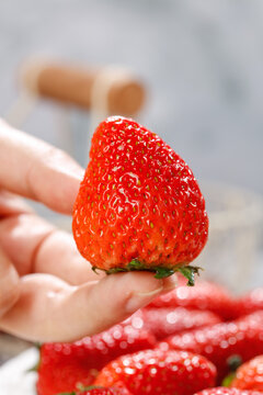 Fresh Strawberry Held in Hand - Studio Still Life Photography