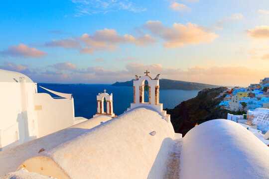 white church belfries and volcano caldera landscape, beautiful details of Santorini island, Greece