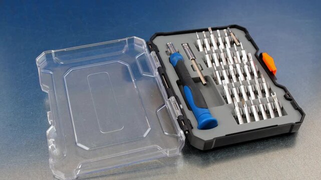 A set of tools with bits in a plastic case.