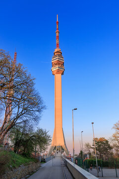 5 April 2026, Belgrade, Serbia: Modern Avala Tower piercing a bright blue sky, showcasing Belgrade's iconic architectural landmark and communication hub