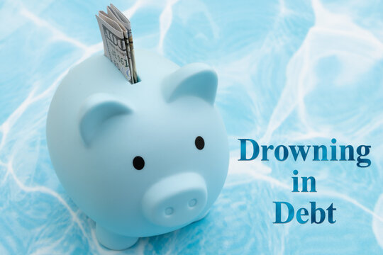 Piggy bank drowning in debt financial crisis