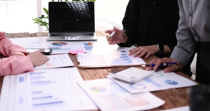 Hands and graphs on tablet screen for finance results, profit growth and budget review. Staff, team and digital with financial report, revenue stats and dividend comparison of risk assessment