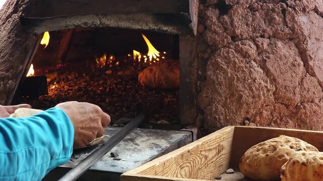 Close-up of dough pieces for traditional Moroccan tafarnout bread, baked in a traditional oven on small stones in a local bakery. The concept of traditional Moroccan cuisine
