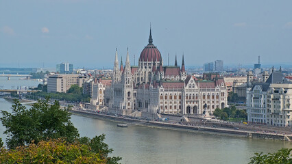 Obraz premium High angle view on the Hungarian National parliament building in gothic revival style along Danube river in Budapest, Hungary 