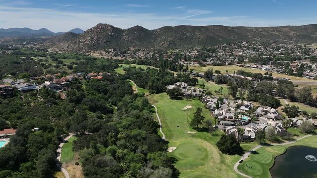 Aerial view of Ramona neighborhood with mountain, valley and San Vicente Golf Course, in California, USA