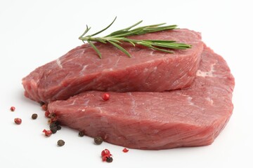 Fototapeta premium Pieces of raw beef meat and spices on white background