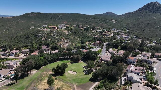Aerial view of Ramona neighborhood with mountain, valley and San Vicente Golf Course, in California, USA